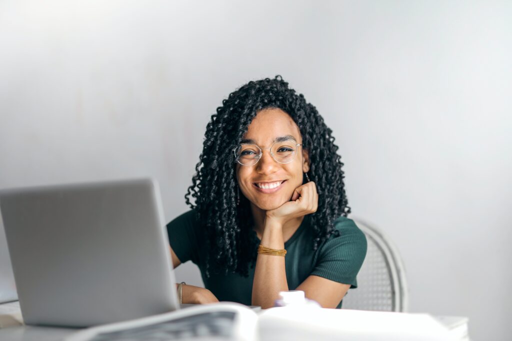 Woman with laptop smiling